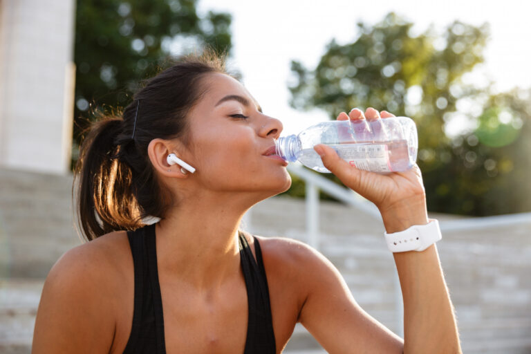 portrait-young-fitness-woman-earphones
