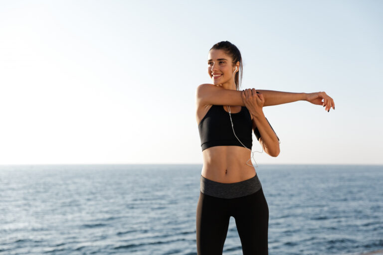 smiling-lady-making-exercises-while-training